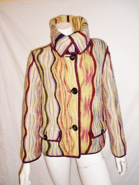 A Fabulous Missoni wool wave knit jacket, new never worn, multicolored of yellow,green,lavender,ruby,pink, white, and grey. 3 four-hole buttons for closer, 2 flap pockets on the front, cow neck line ,bust:40'' , waist: 36'', sleeves:21'',