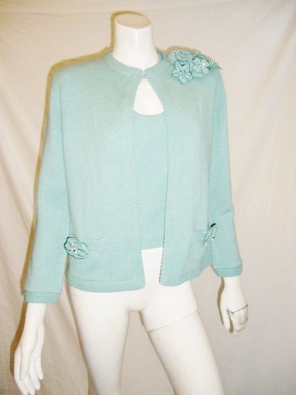 Chanel aqua blue sweater set, sleeveless top, top jacket cardigan with very decorative trim, 2 front pockets, hook and eye top closure, and 7 removable hand made pins, each pin is embellished and embroidered with Swarovski crystals and pearls, size