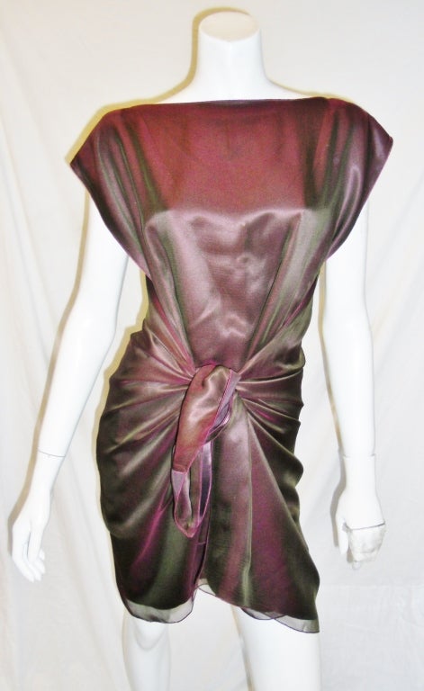 No buttons no closures and no zippers.Master of minimalism and true architect of fashion designer Zoran made this amazing dress that just wraps around your body and ties on the front into amazing dress.reversible from burgundy to iridescent chiffon 