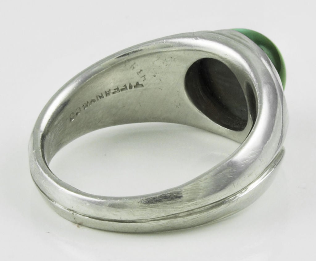 Very rare GIA certified cat's eye alexandrite of between four and five carats and containing a sharp eye that opens and closes and undergoing a noticeable color change in an elegant platinum ring signed 