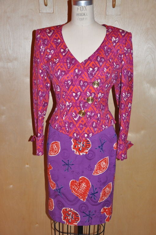        This rare whimsical Christian Lacroix multi-colored, multi-patterned cotton poplin suit has colors of fuchsia, purple, white and reds accented with 