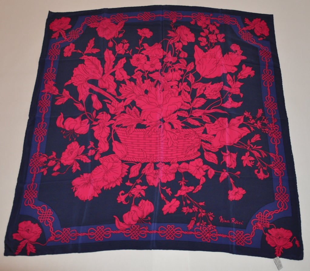 Nina Ricci bold silk crepe de chine floral print scarf is rich in color. The scarf measures 34
