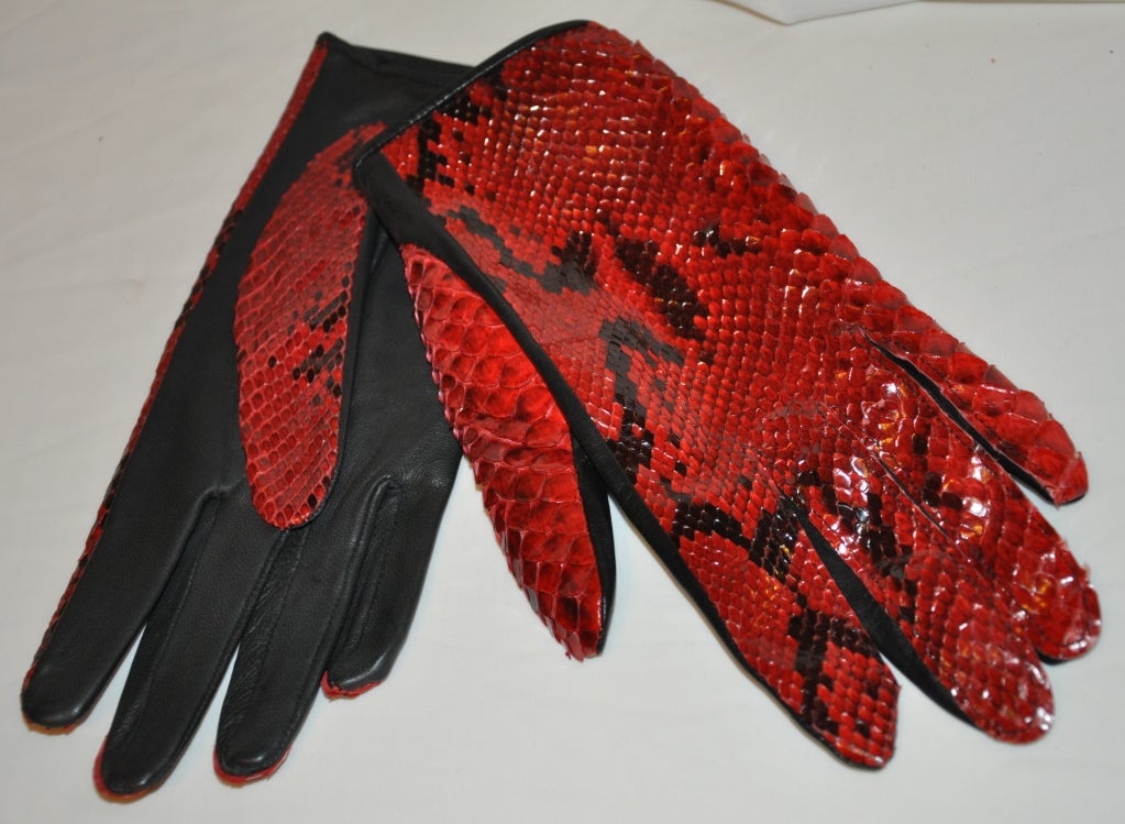 Yves Saint Laurent Red & Black Pylon with black lambskin leather gloves are size 7 1/2. The total length of the gloves measures 9