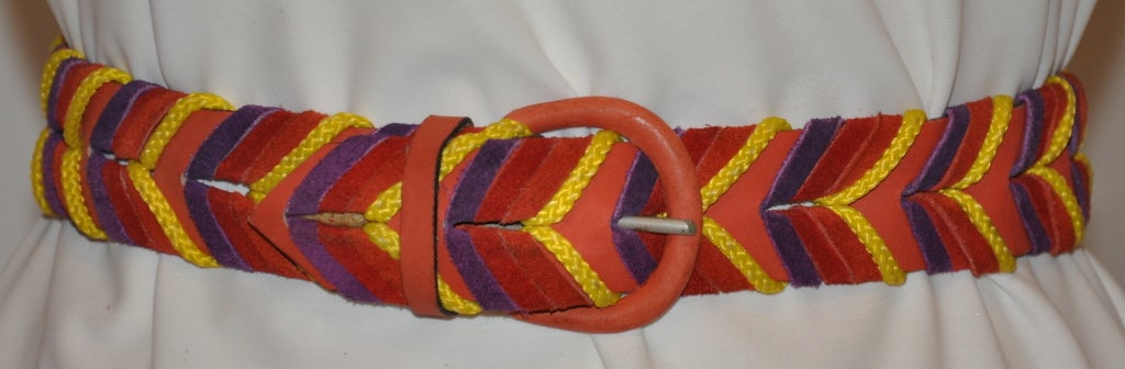 Ted Lapidus multicolored suede belt is accented with yellow cord braided together. The width measures 1 1/2