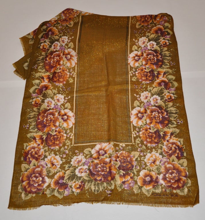 Oscar de la Renta Floral print scarf has gold metallic threads highlighting. The wool challis scarf measures 24