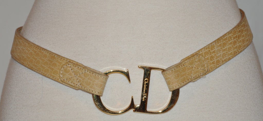 Christian Dior beige leather belt has their signature CD logo embossed on the belt along with the 