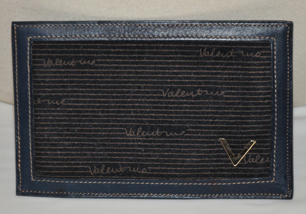 Valentino Dark-navy calfskin with suede wallet is accented with the Signature 
