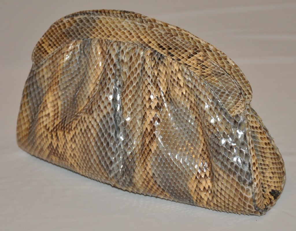 Morris Moskowitz reptile zipper clutch has hues of pale steel blue, taupe and tan. The clutch has a zipper top and is fully lined.
  The clutch measures 5 1/2