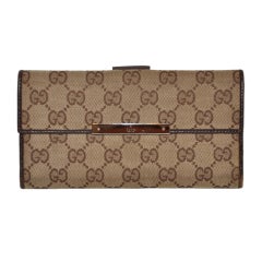 Gucci "GG" Canvas and pigskin leather billfold wallet