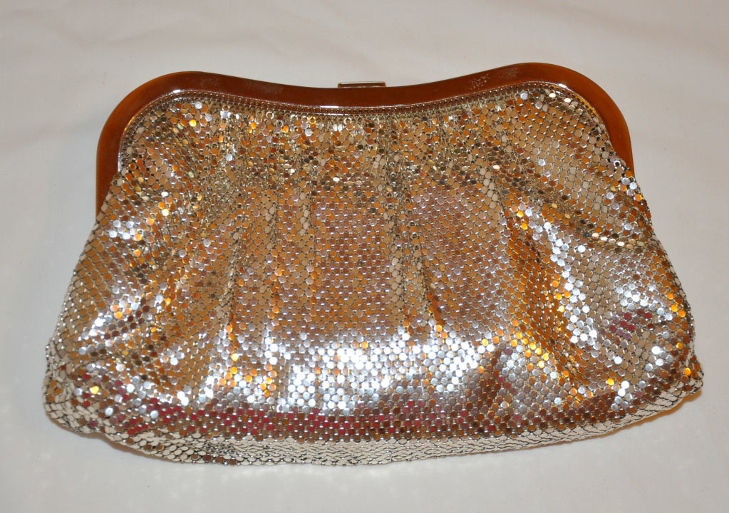 Whiting & Davis silver mesh evening clutch has detailed rhinestone clasp closure. The evening clutch comes with a matching silver mesh change purse. Both items have the signature 