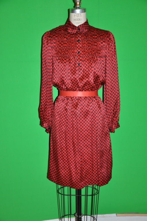 This Geoffrey Beene Red and Black checkered dress can be worn belted as shown or loose. There's 7 1/2