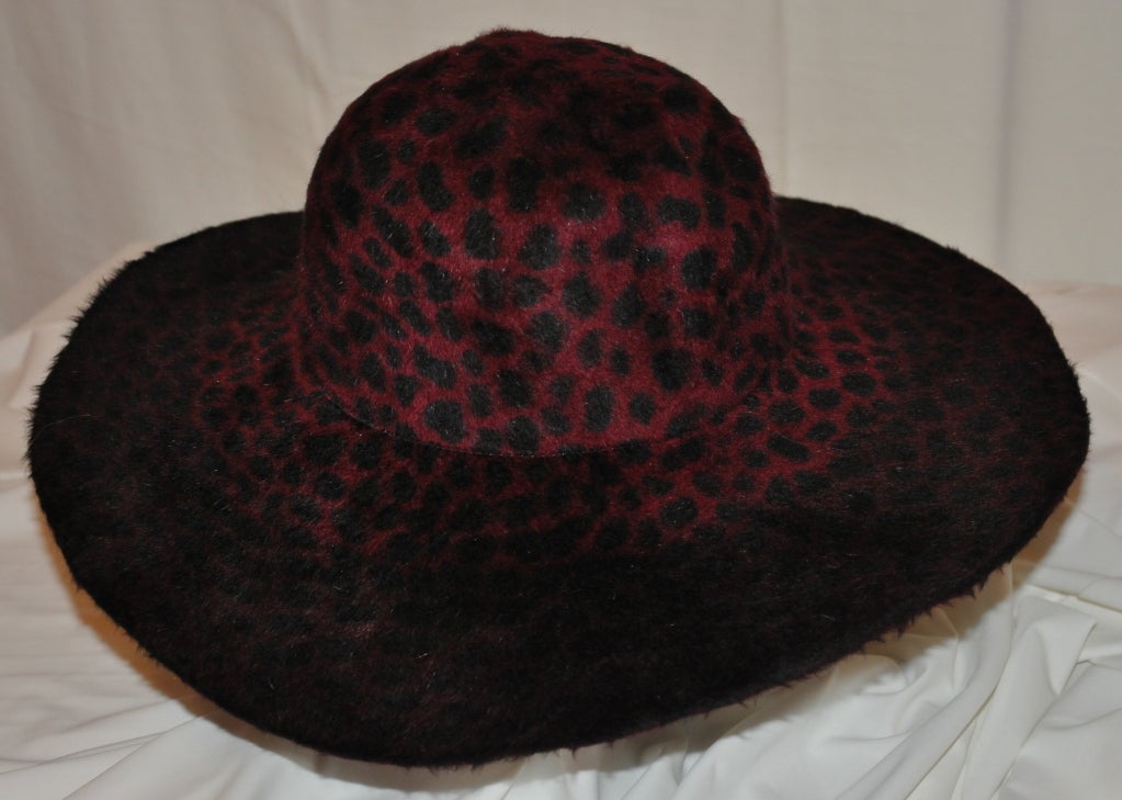 Anna Sui large-brim leopard print hat is in hues of wine and deep red.
  The height of the hat measures 4