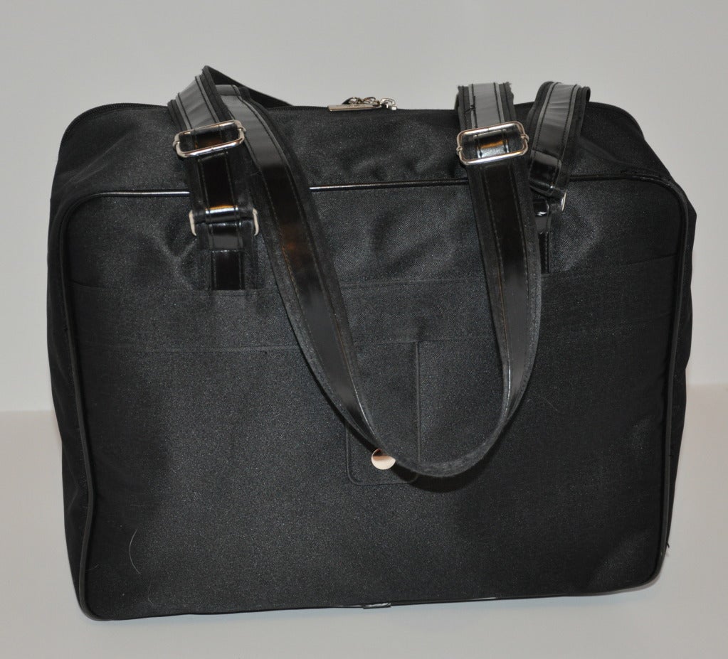 This lightweight Carlos Falchi Black travel tote bag has double handles which are adjustable measuring from 9