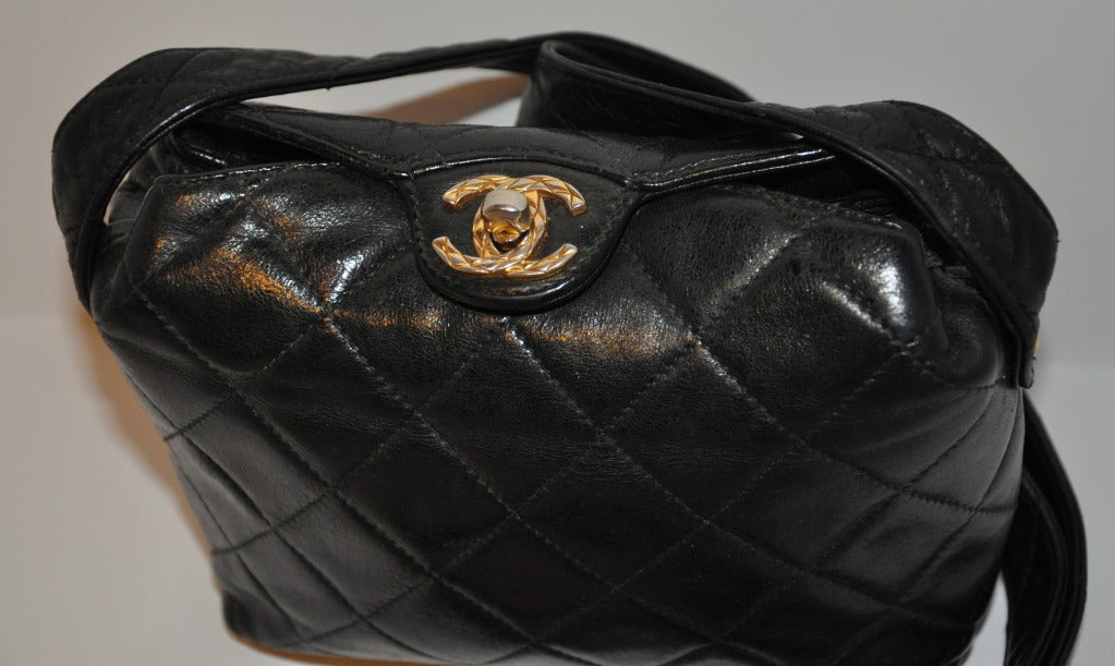 Chanel miniature black lambskin quilted leather shoulder bag measures 5 1/2