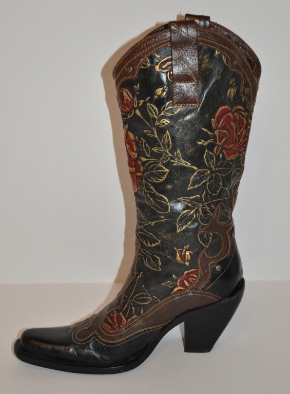 These wonderful Embossed Calfskin leather high boots are hand-painted with red roses highlighted with gold leafing. The heels measures 3 1/2 with thick soles for durable wear for everyday. With gold hardware studs accents and detailed brown calfskin