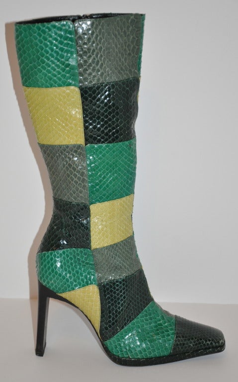 Casadei Multicolor patch butter soft snakeskin boots have side zippers to better fitting. Snakeskin are in hues of pale green, green, forest green and gray. The front has a slight platform measuring 1/2