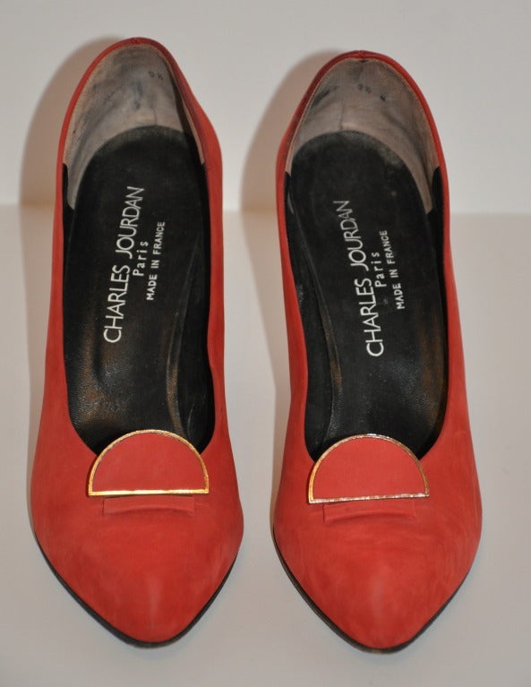 Charles Jourdan Fire-Red Suede Pumps is highlighted with gold-hardware on the heels. Size is 9 1/2 French medium width, American 9 1/2 medium width. Heels measures 4