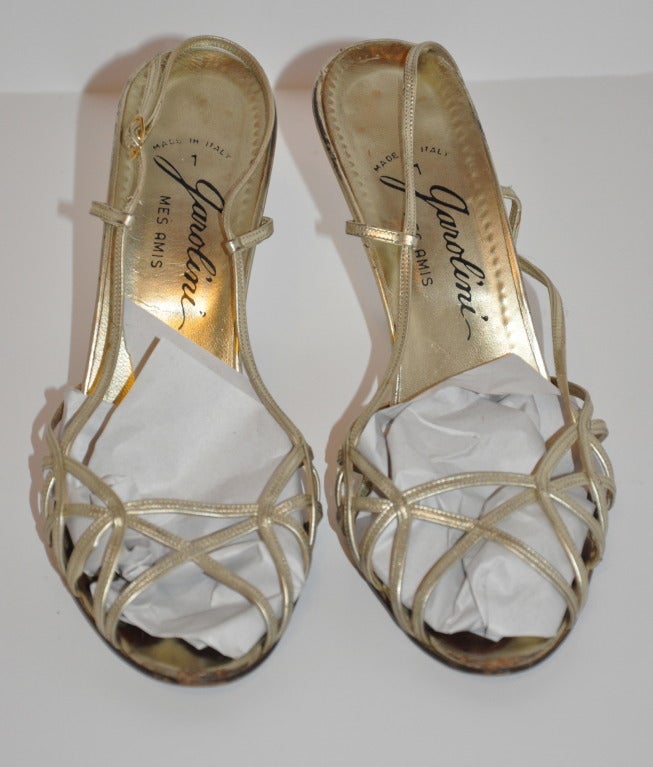 These classic Garolini gold calfskin sandals completes any couture ensemble. Heels measures 3 5/8