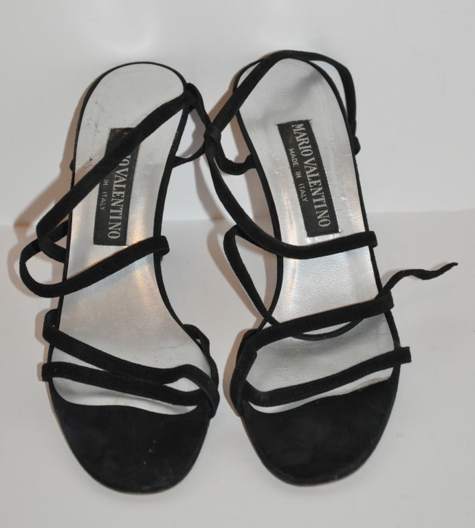 Mario Valentino black calfskin suede sandals has a criss-cross front along with side opening straps. Size is 38 Italian, American 8. Heels measures 3 3/4