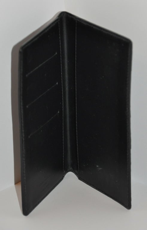 Louis Vuitton black embossed calfskin leather wallet measures 3 3/4