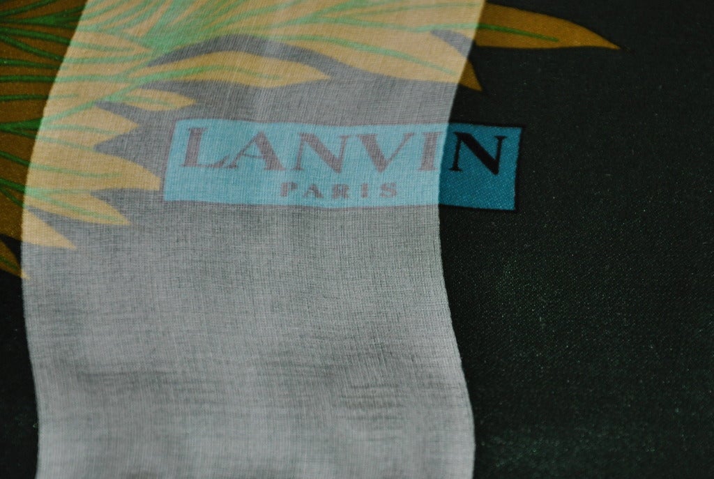 Lanvin's floral print silk & silk chiffon scarf has colors of forest-green, emerald-green, green, olive-green, beige, and brown. Hand-rolled edges are Irish-green. measurements are 33 1/2