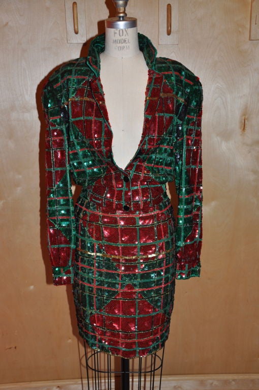 This Red, Green & Gold fully sequined 2-piece Mini Suit has a Diamond Pattern. Both jacket and skirt are fully sequined and also fully lined in silk organza. The skirt has a zipper, along with elastic on the waistband for a better fit. There's also