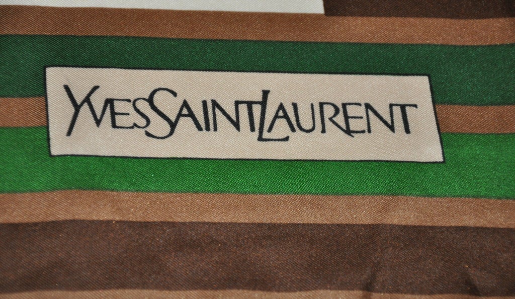 Yves Saint Laurent's signature bold abstract print silk scarf are in colors of forest-green, green, cream, coco-brown and brown. This wonderful silk scarf measures 30