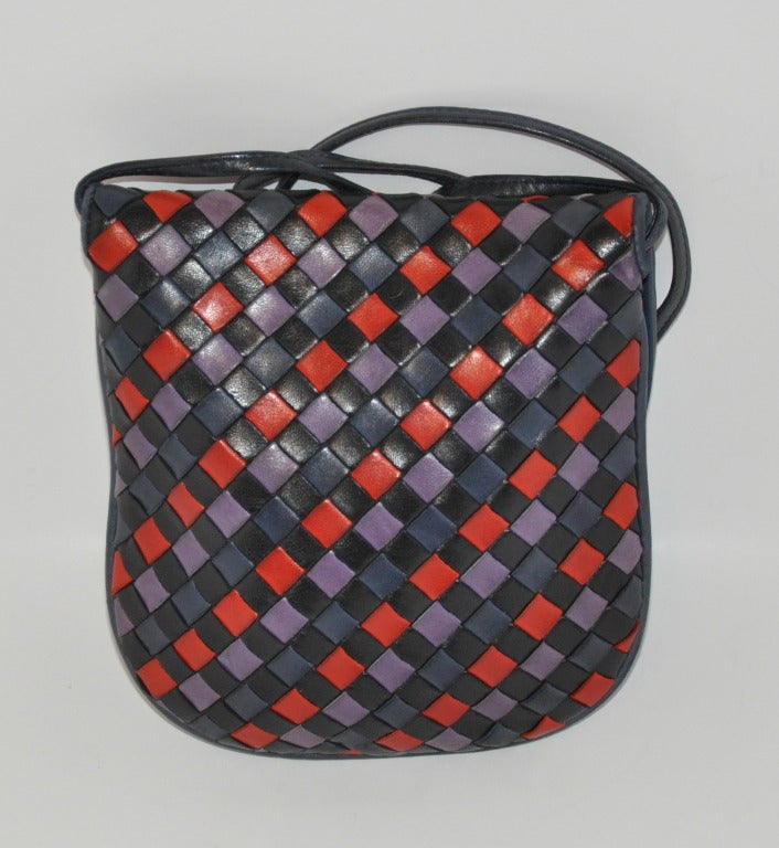 Bottega Veneta multicolored cross-body shoulder bag can be also worn as a clutch if desired. Just simply curl the straps and tuck inside. Shoulder straps measures 22 1/2
