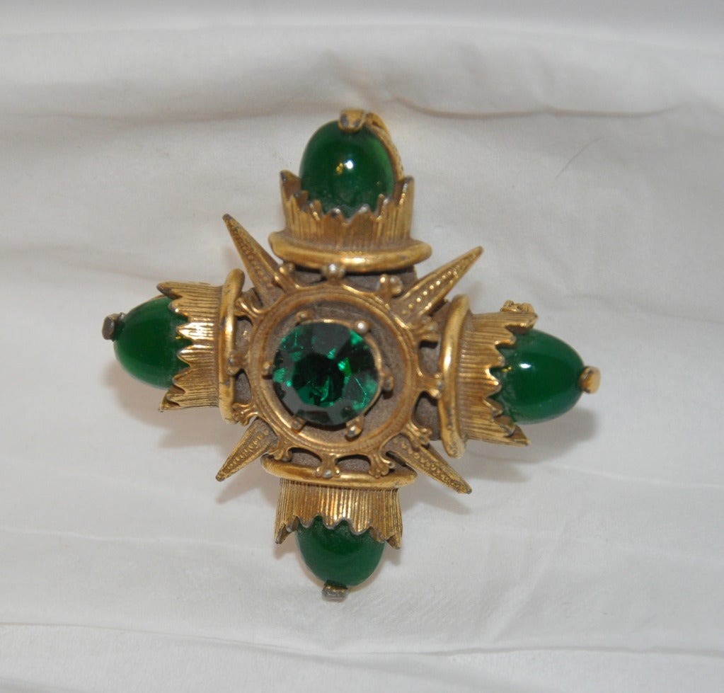 Eisenberg's large gold hardware with cabochon and rhinestones piece can be worn either as a brooch or as a pendant.
   Supreme detailing on the gold hardware, with the greens highlighting how well the detailing is done.
   Measurement are 2 1/8