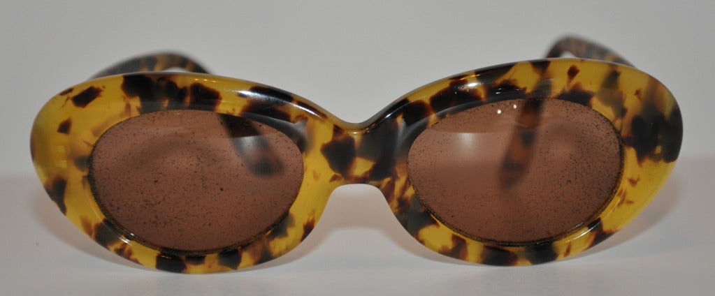 Emmanuelle Khanh hand-made tortoise shell sunglasses are accented with gold hardware 