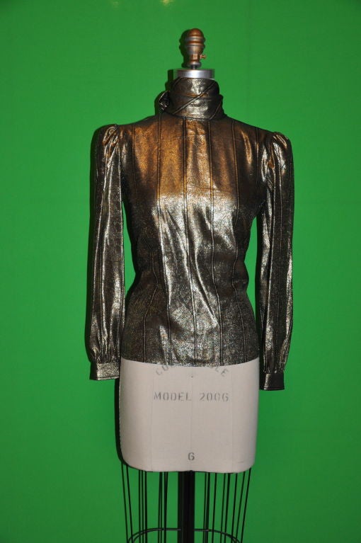 This Valentino gold and black lame blouse has a extended scarf-tie that measures 9