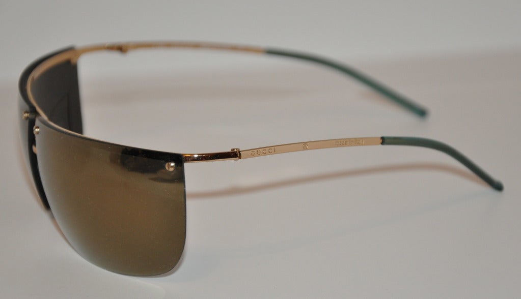 Verspiegelte Sonnenbrille von Gucci mit Goldbeschlägen (Braun) im Angebot