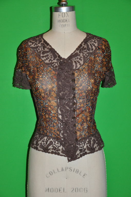 This wonderful Valentino's 'Boutique' Multicolored floral print top are in shades of light and dark browns with accents of brick and cream colors. The lace accent detailing makes this chiffon and lace combination so elegant. The ten (10)
