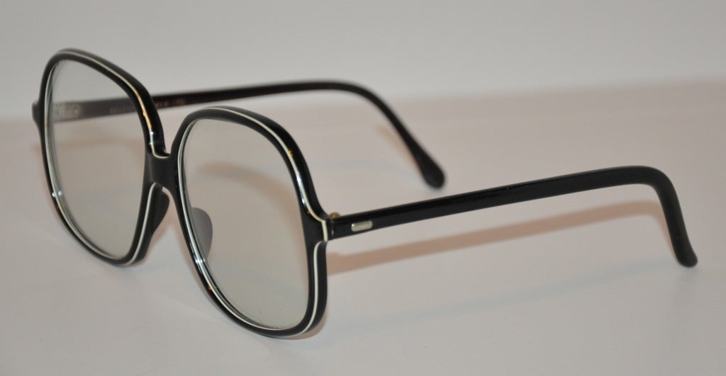 Bernard Kayman Ltd's huge black rimmed glasses are wonderfully etched with white in-between on the front. Front measures 2 1/2