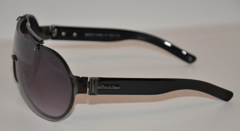 Gucci black sunglasses measures 2 1/4