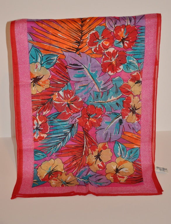 Albert Nipon cotton scarf has vibrant multiple colors of reds, greens, lavender, coral, white and outlined with black. Bold floral print makes this a perfect scarf for your summer wear. Scarf measures 16 1/2" x 62".