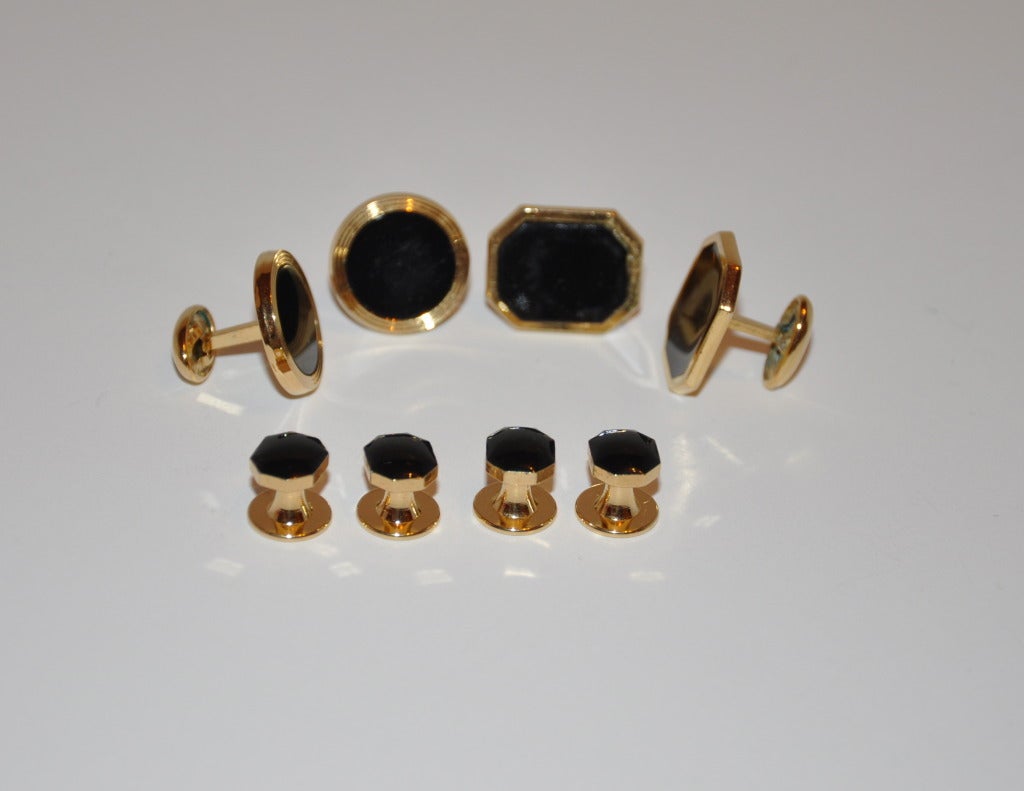 Pierre Cardin Cufflink set of gold hardware centered with black onyx, with Pierre Cardin's  signature logo is engraved on the back-side. Gold hardware has a vermeil polished finish.