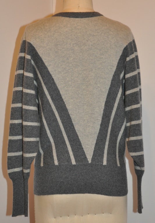 V-neck charcoal & gray cashmere sweater has domain sleeves. Front center measures 17