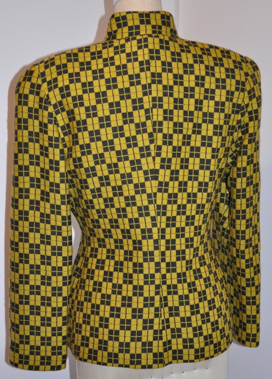 Spazio black & yellow knit jacket has silver hardware snap front. Each of the snaps has their signature name engraved on each.
   Mandarin collar measures 2