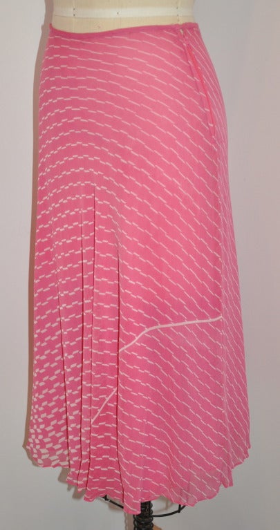 Judy Hornby 'Couture' double-layered silk-chiffon of pink with white abstract print bias-cut skirt fits wonderfully because of the bias cut silk. The waist is finished with silk chiffon piping for a clean finishing.
   Side zipper measures 6 1/2