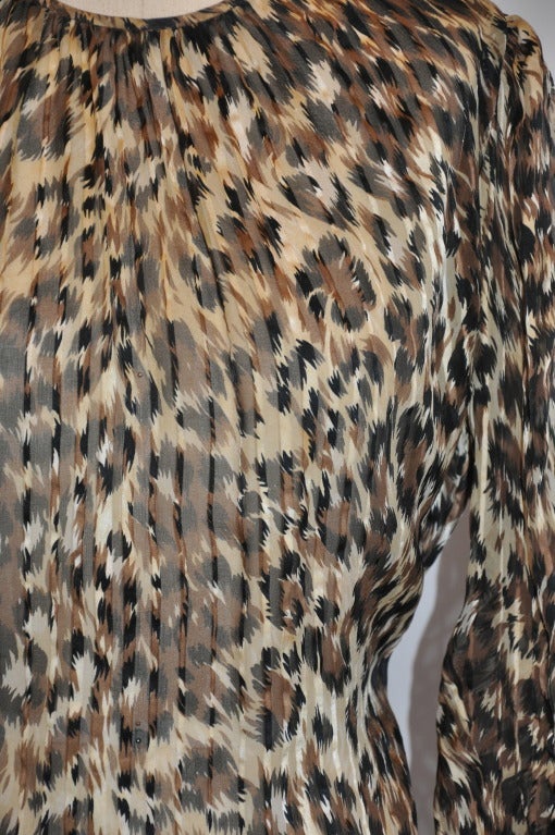 Adrianna Papelli silk chiffon leopard-print blouse with shades of browns has a five-button shoulder opening. The sleeves have slight gathering along the shoulder. Neck-to-shoulder measures 4 1/4