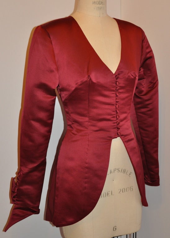 This C.D. Greene's fully lined silk cocktail top is so beautiful with details that one would love to wer it inside-out. The silk lining is so detailed, that, we think it just might be possible after all.
   Detailed with silk covered buttons, the