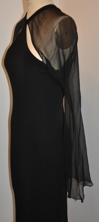 C. D. Greene fully lined black silk jersey with silk chiffon sleeves has a wonderful invisible back zipper located on the center back measuring 10 1/2