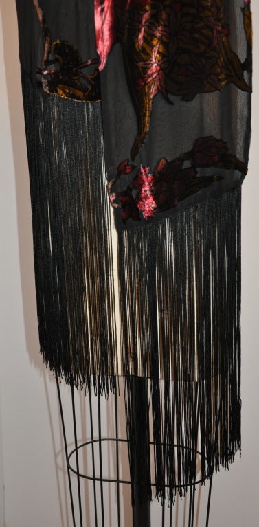 Adrienne Landau dramatic multi-shade patterned velet scarf is accented with extra-long fringes is double layered and measures 10