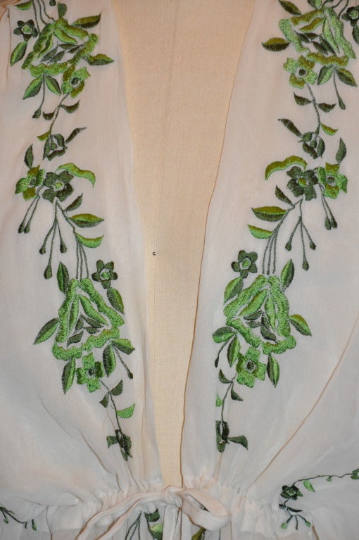 This wonderfully elegant drawstring silk chiffon hand-embroidered drawstring kimono-style top is also lined with silk chiffon.
   Green hand-embroidered floral is with green silk threads. 
Sleeve's hem-to-collar measures 24