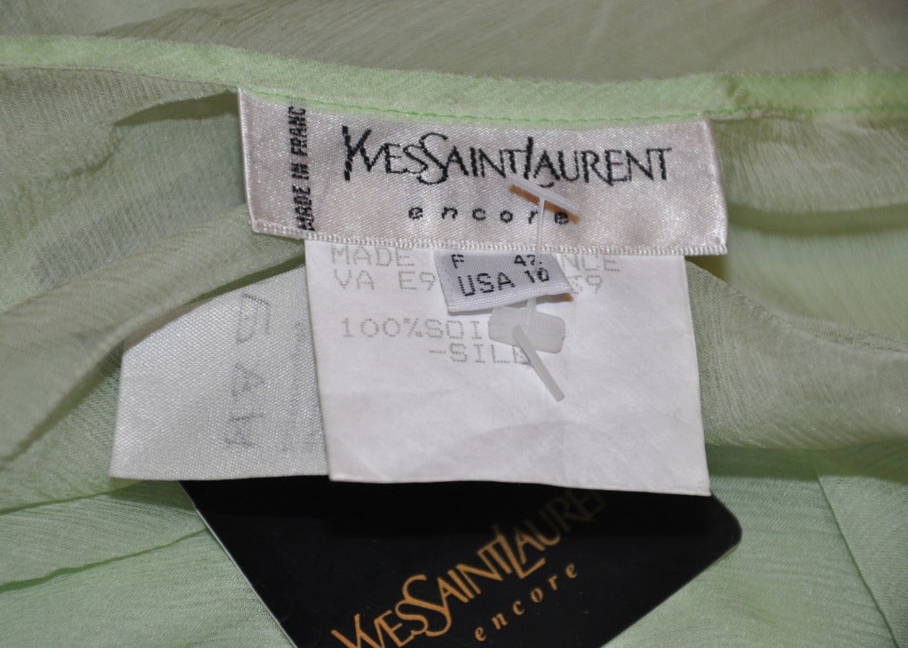 Yves Saint Laurent pale-green silk chiffon tank top still has original tags attached.
   Sized 42/French, 10/US.
   Underarm circumference measures 39