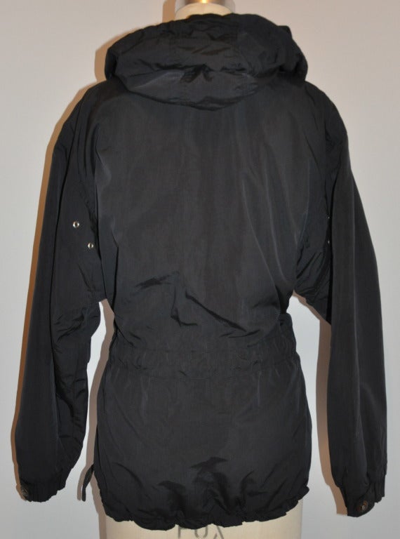 Bogner black hooded instulated jacket with waist ties for added fit and a front zipper closing measuring 27