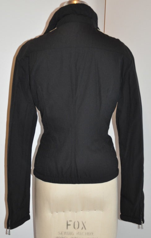 Bogner black with cream double-stripe zippered jacket is styled with a high collar of 4 1/2