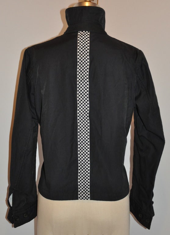 Commes des Garcon zipper jacket has a racer's check stripe accented on the center back.
   Zipper measures 20