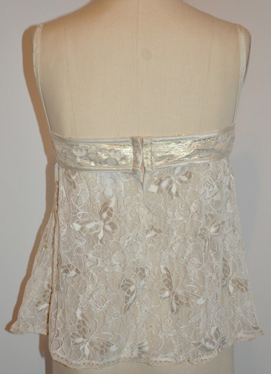 Dolce & Gabbana stretch lace top in cream has a built-in bra (34 B-C) has adjustable shoulder straps.
   Front measures 16 1/2